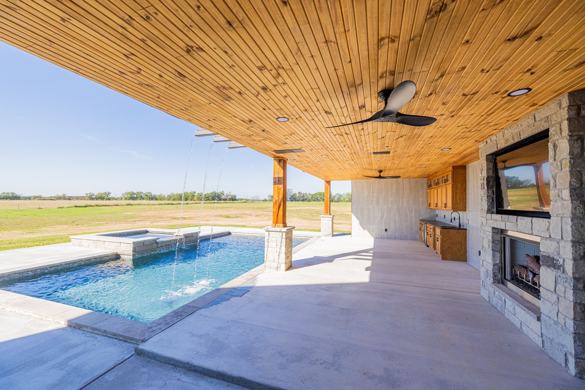 Outdoor Entertaining Space with Pool and bar at a Modern Luxury Home